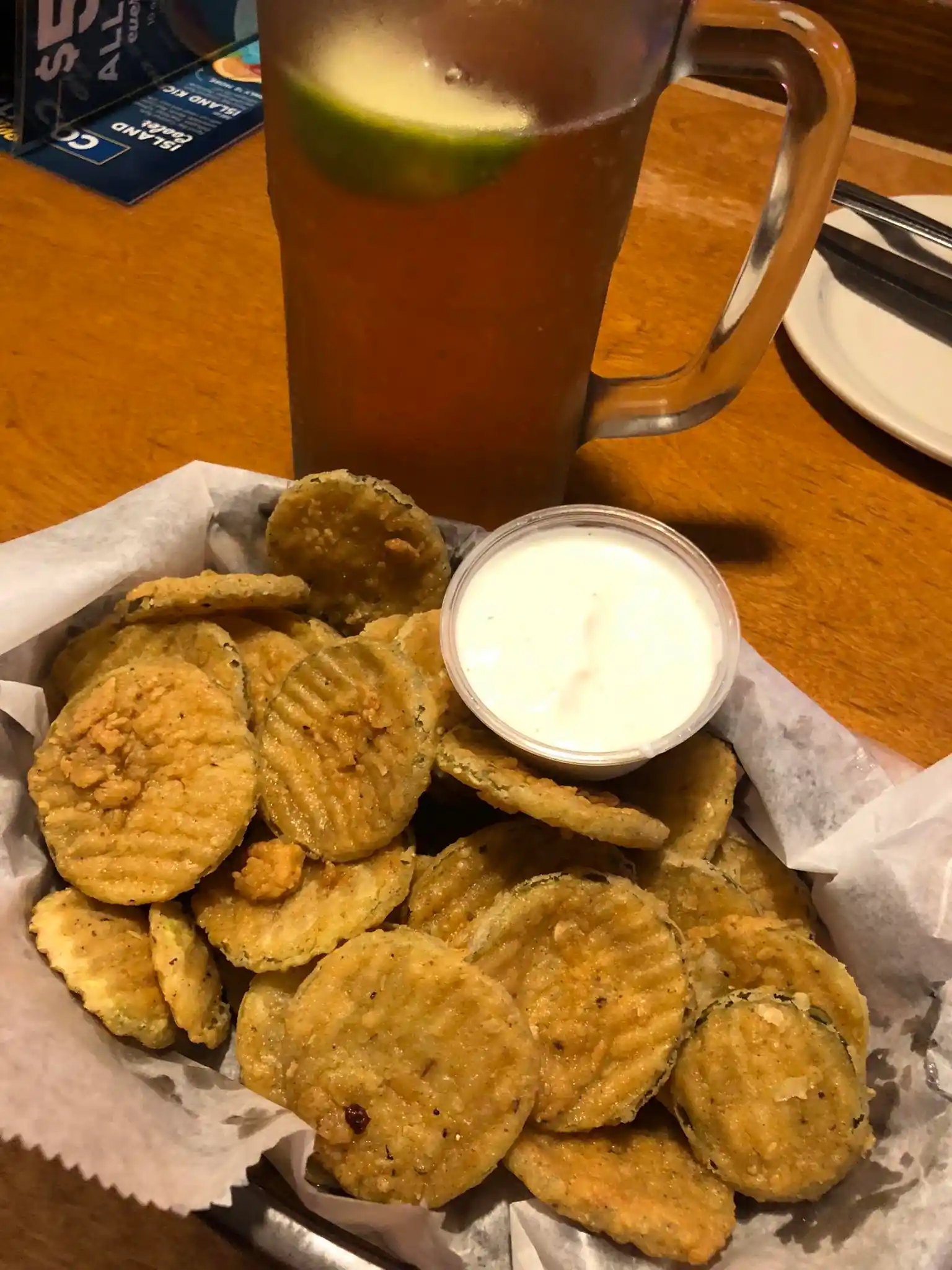 Crispy golden-fried pickle chips with ranch dipping sauce