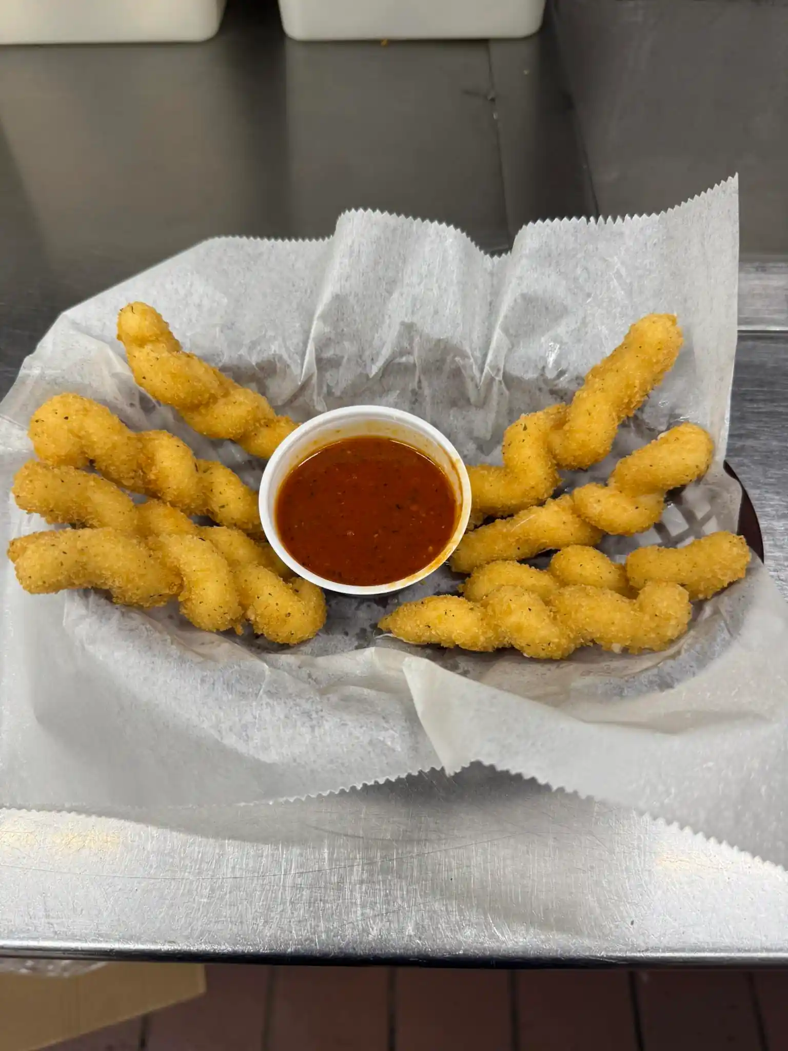 Twisted mozzarella sticks golden fried with marinara